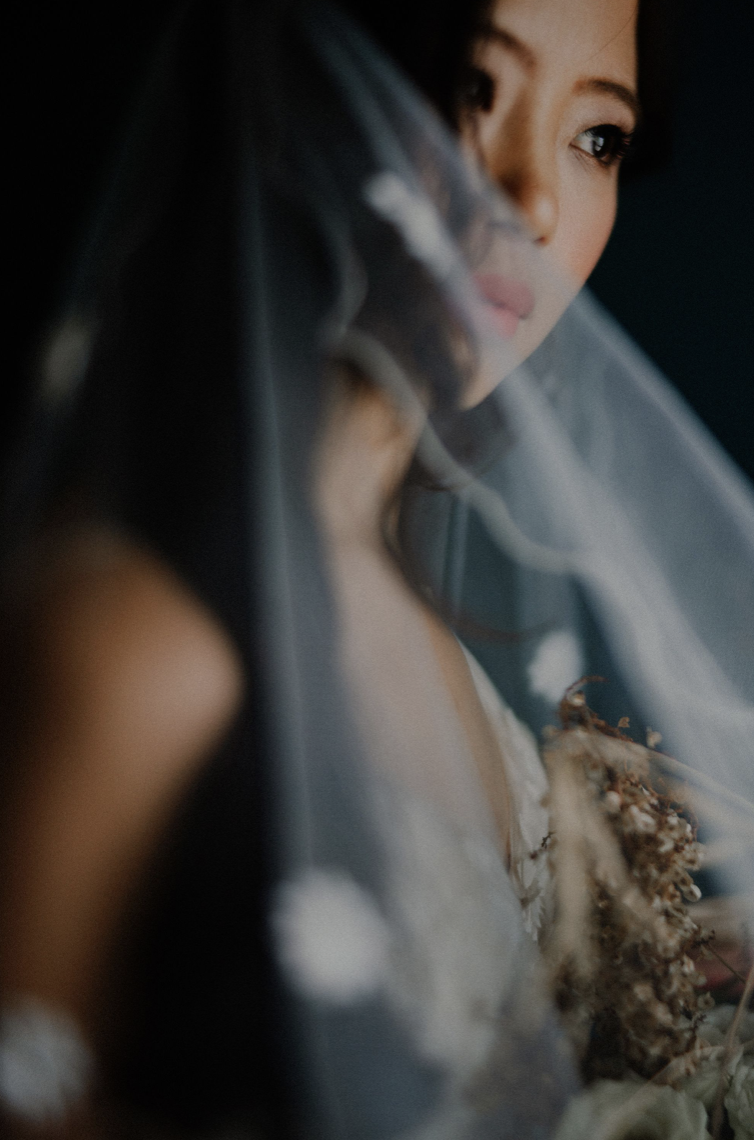 Ophelia — her face softly revealed through the veil