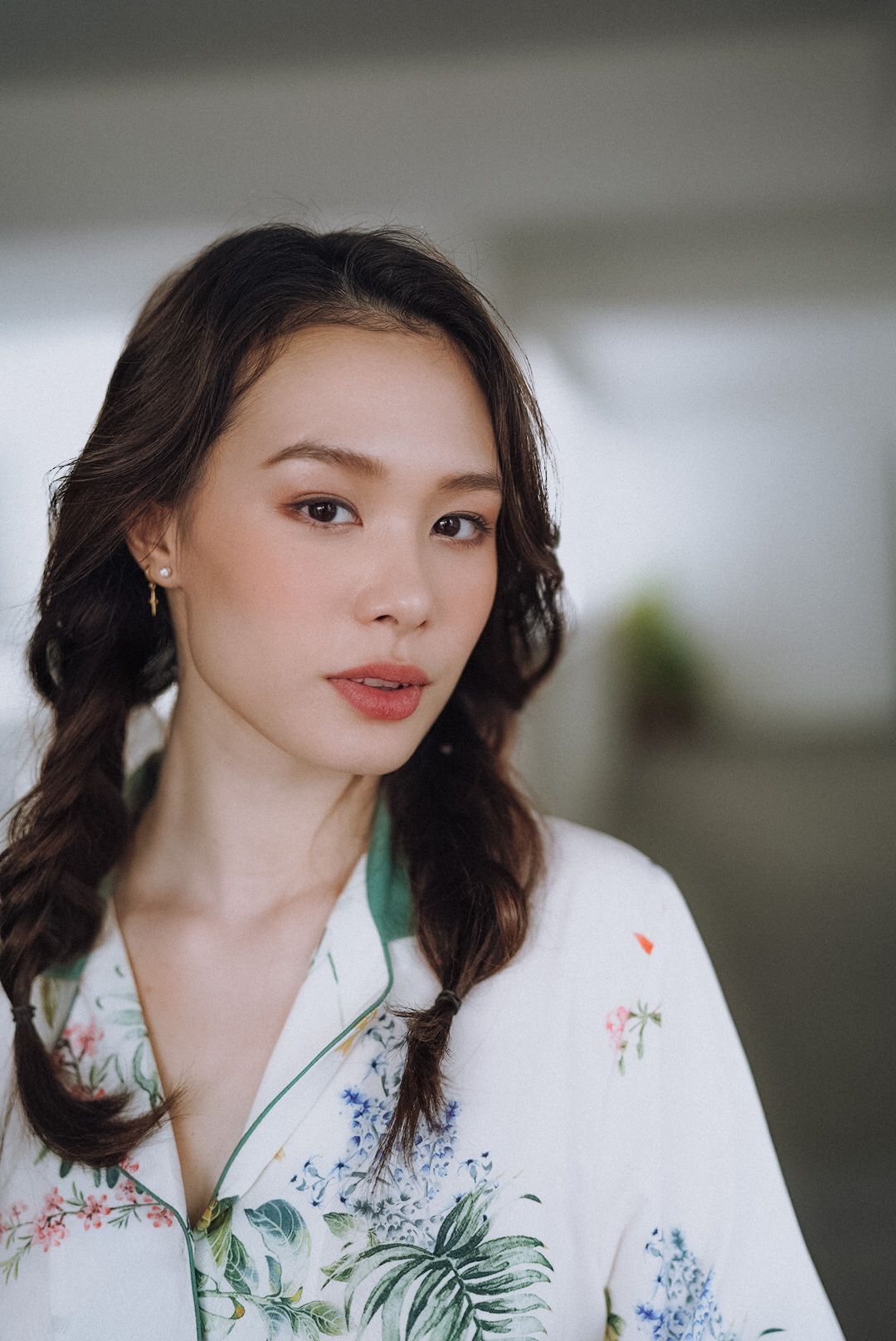 Cala Barrett — loosely braided hair in the green floral shirt