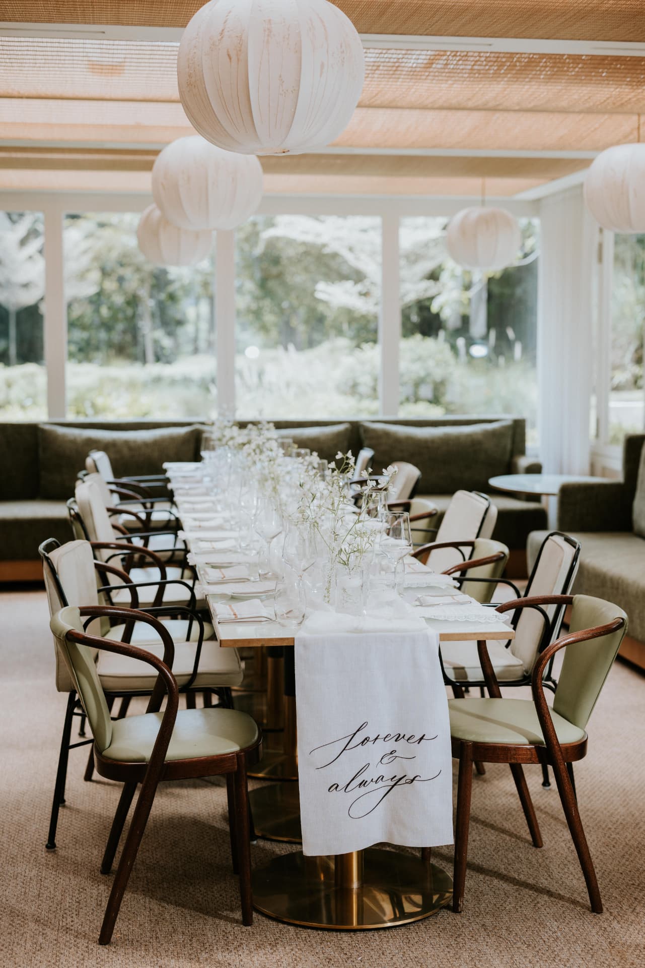 Cloud Dancer — the dinner table under paper lanterns with the Forever & Always linen