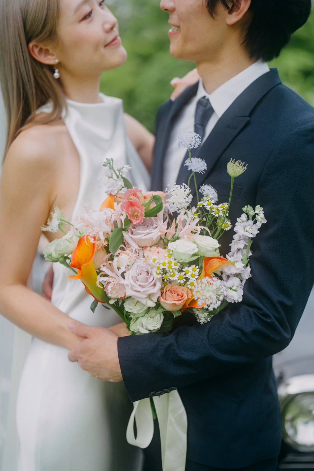 Tim & Denise holding the wildflower bouquet
