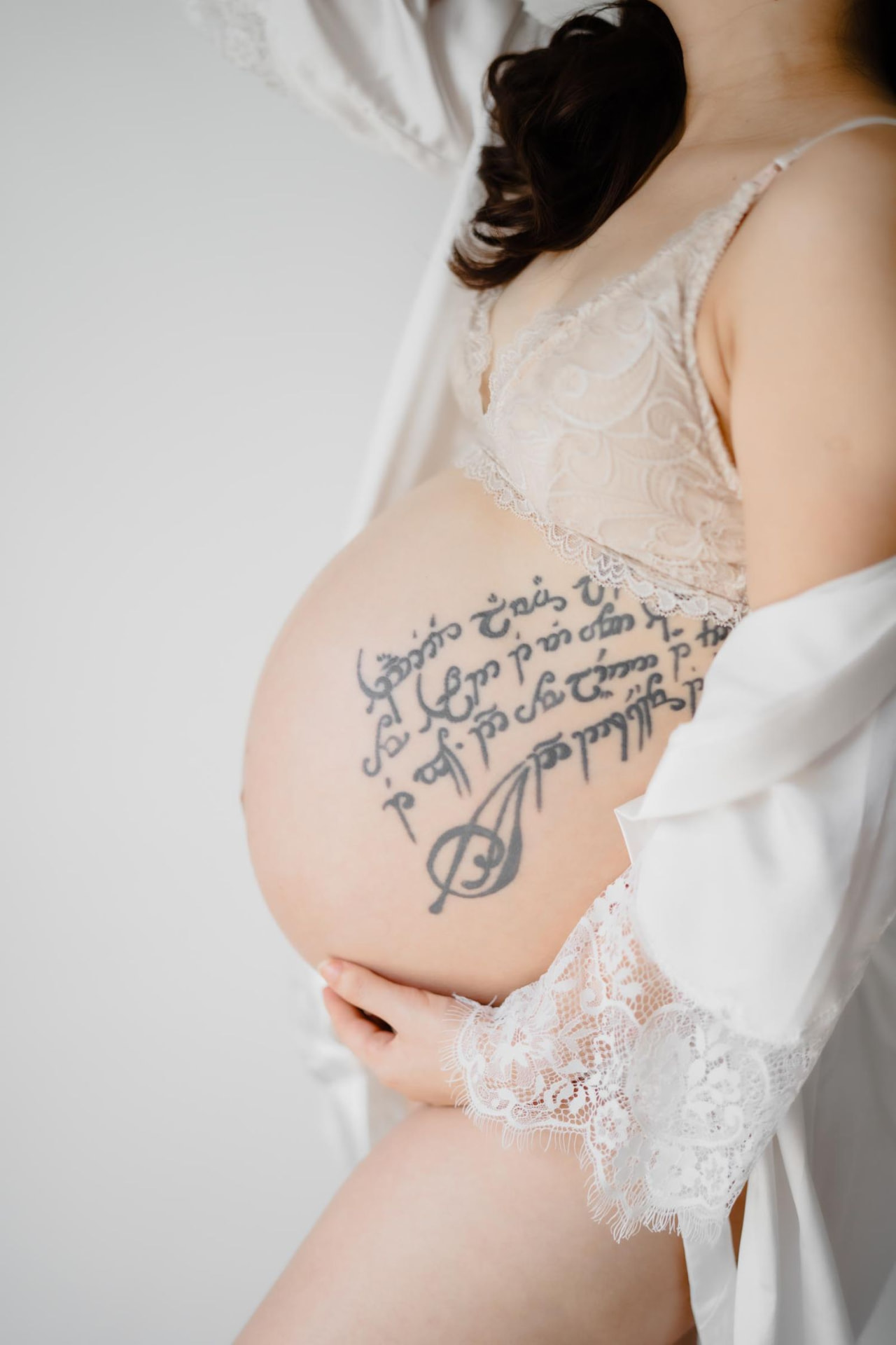 Vivian Ho — bump detail in lace and a white silk robe