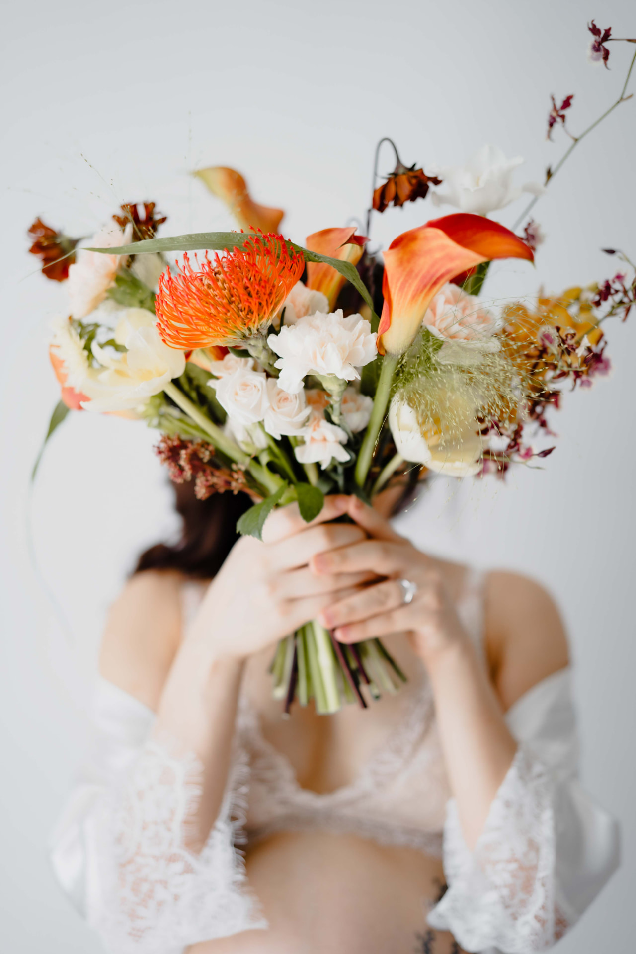 Vivian Ho — hidden behind a vibrant autumn bouquet