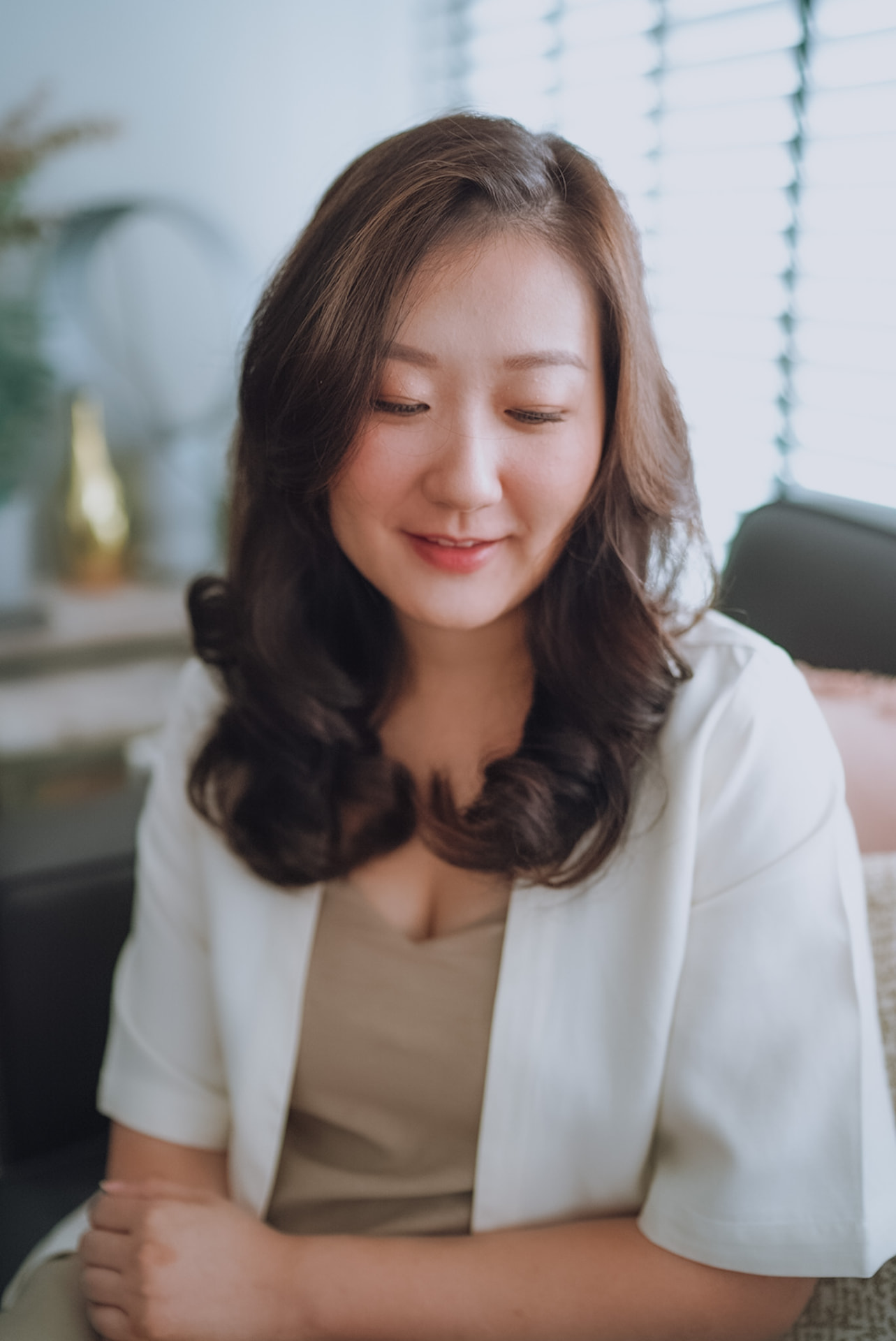 Bride with soft waves, smiling gently